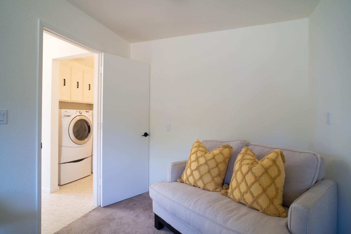25815 Rio Vista Drive Carmel, CA 93923 - Photo 29 of 49 a living room with furniture and a lamp