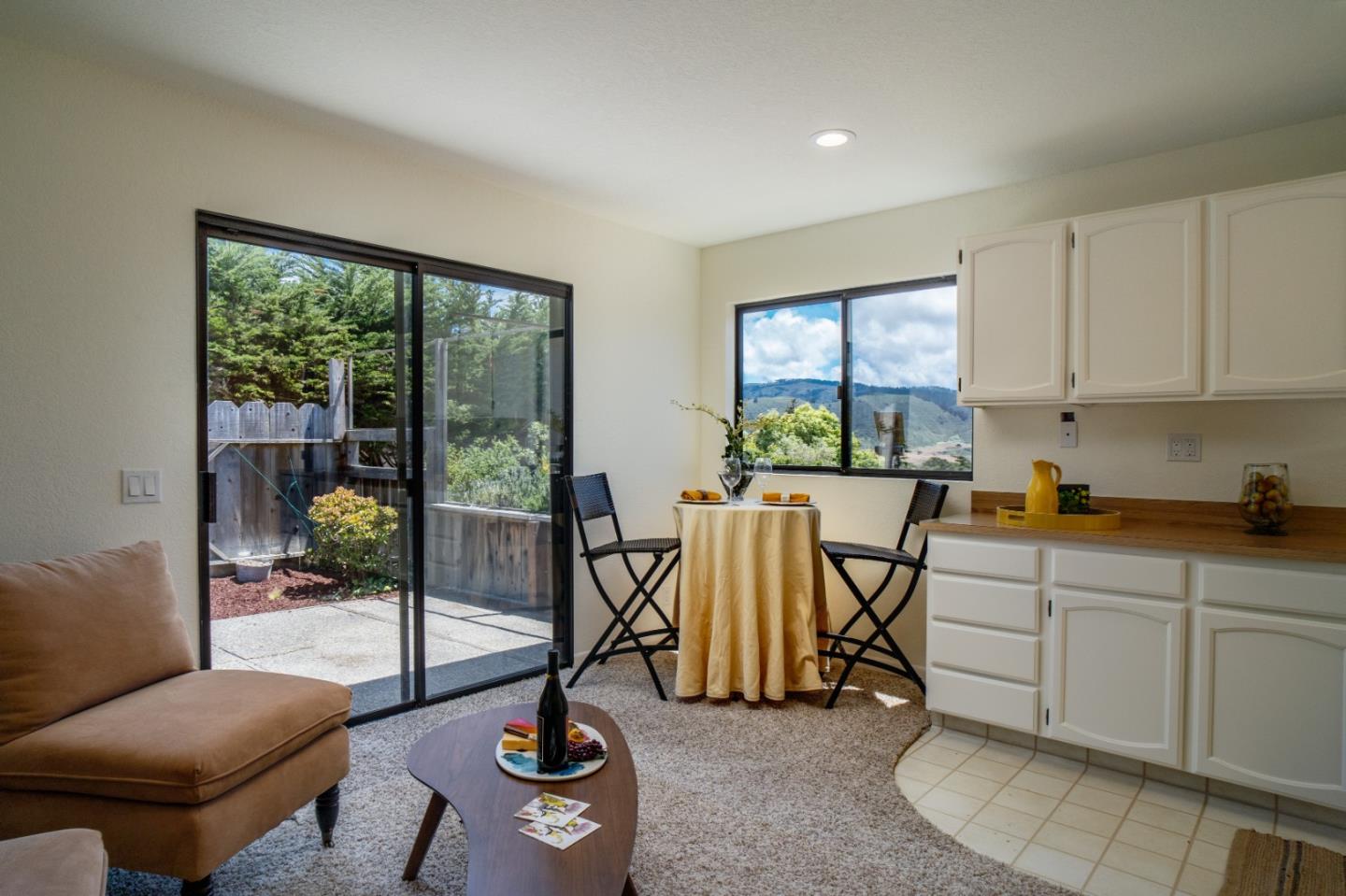 25815 Rio Vista Drive Carmel, CA 93923 - Photo 33 of 49 a living room with furniture a rug and white walls