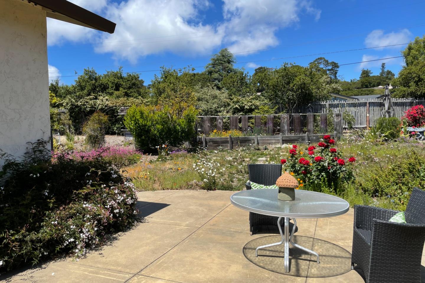 25815 Rio Vista Drive Carmel, CA 93923 - Photo 47 of 49 a front view of a house with a yard and a fountain