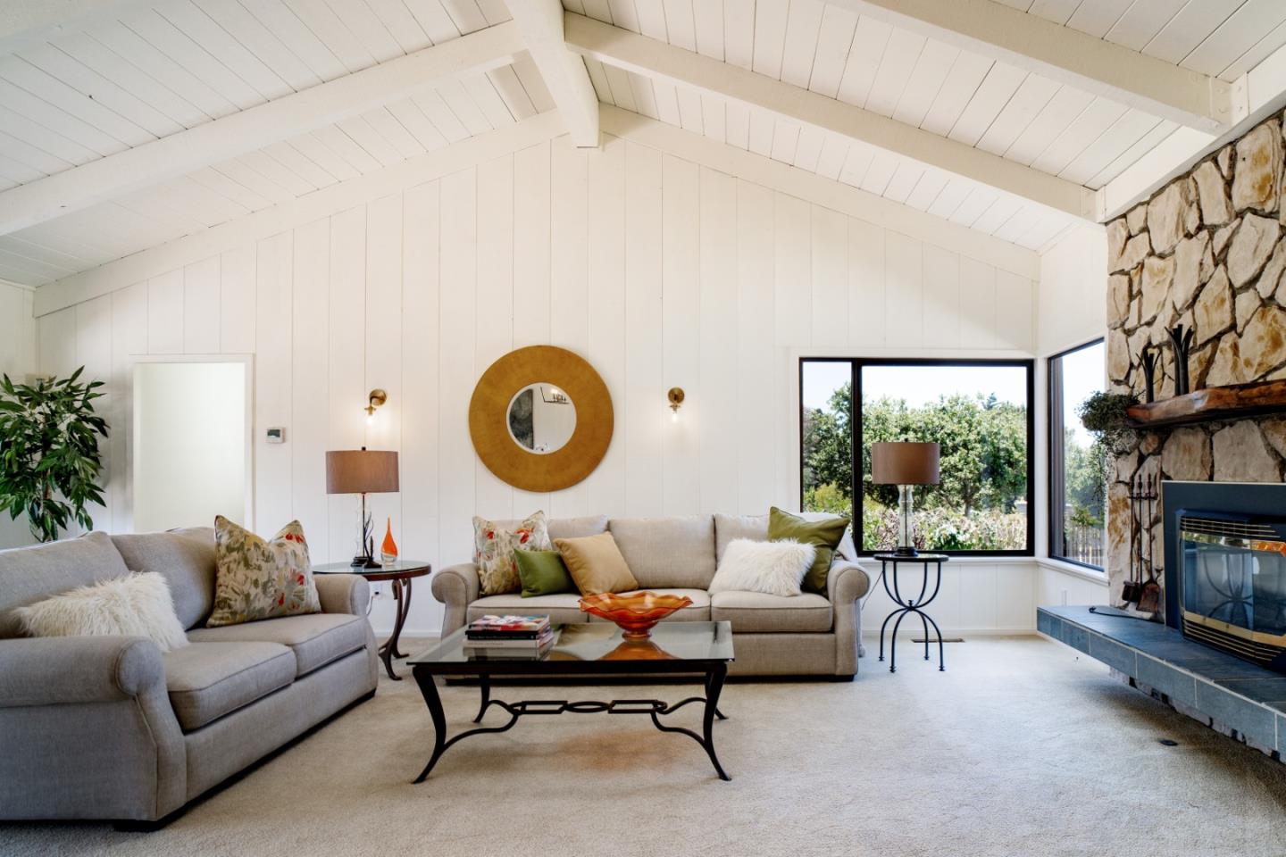 25815 Rio Vista Drive Carmel, CA 93923 - Photo 5 of 49 a living room with fireplace furniture and a large window
