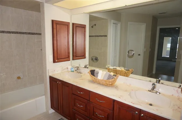 a bathroom with a glass shower door