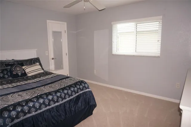 a bedroom with a bed and window