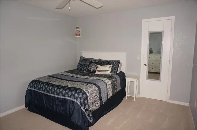 a bedroom with a bed and a dresser