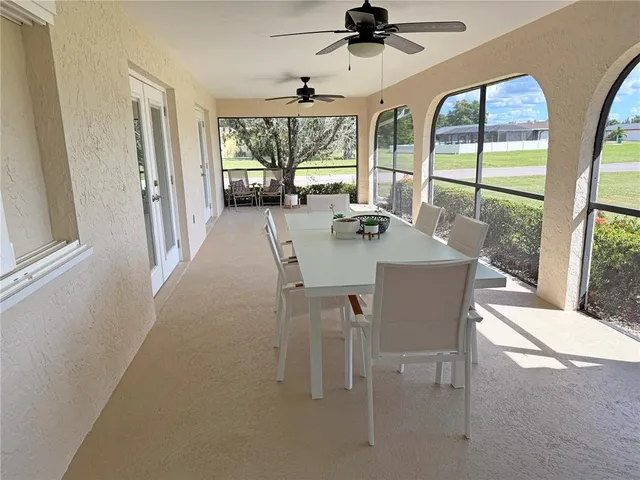 a view of a livingroom with furniture window and wooden floor