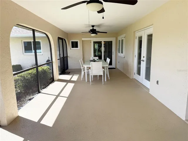 a view of a floor to ceiling window and kitchen area