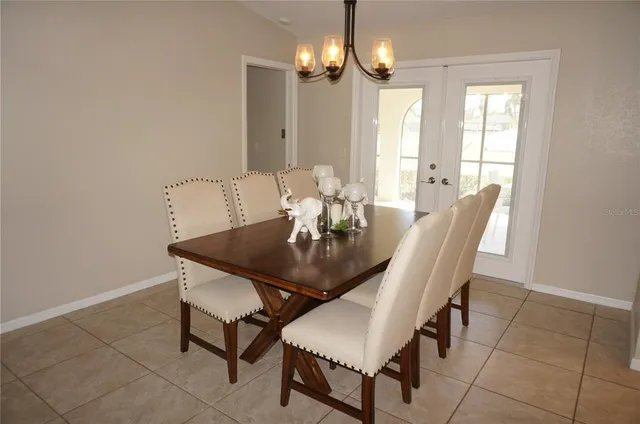 a living room with couches and a flat screen tv
