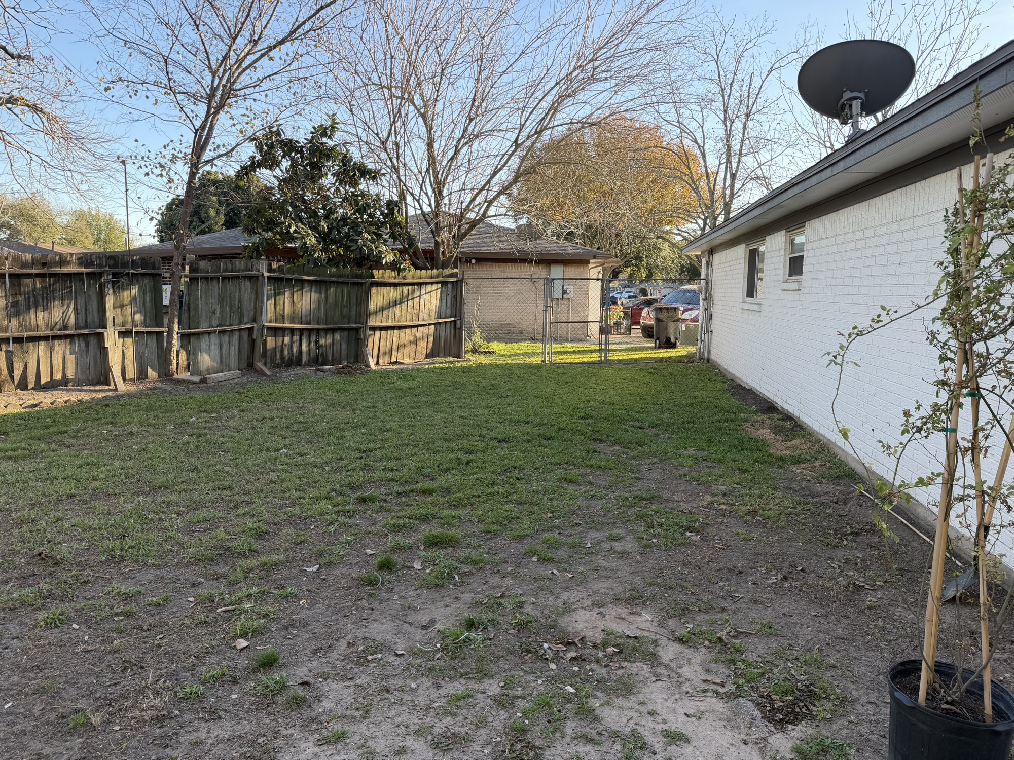 9022 Lazy River Lane Houston, TX 77088 - Photo 11 of 23 a backyard of a house with lots of green space