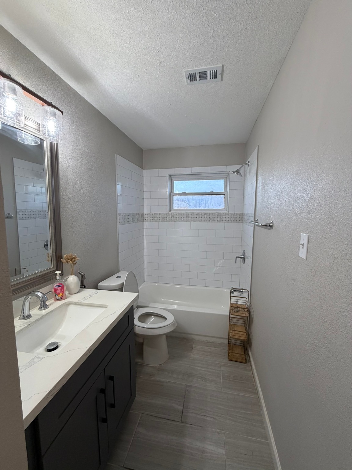 9022 Lazy River Lane Houston, TX 77088 - Photo 12 of 23 a bathroom with a sink a toilet and shower