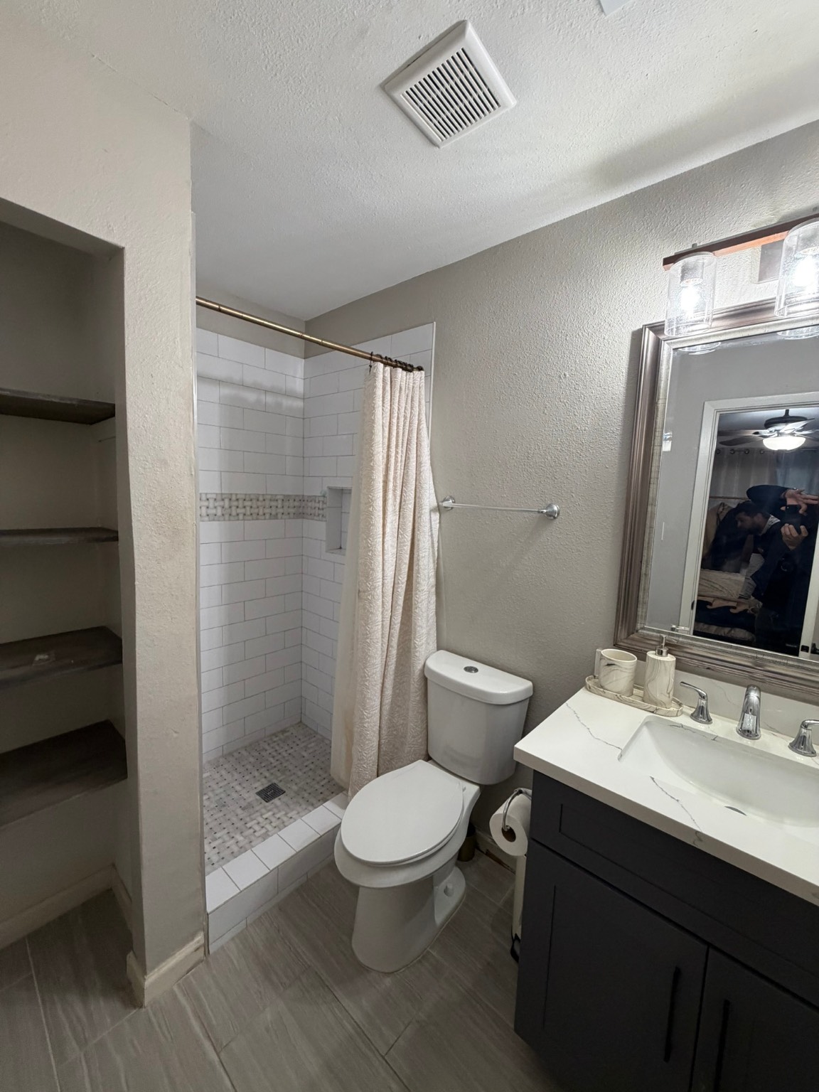 9022 Lazy River Lane Houston, TX 77088 - Photo 18 of 23 a bathroom with a sink a toilet and shower