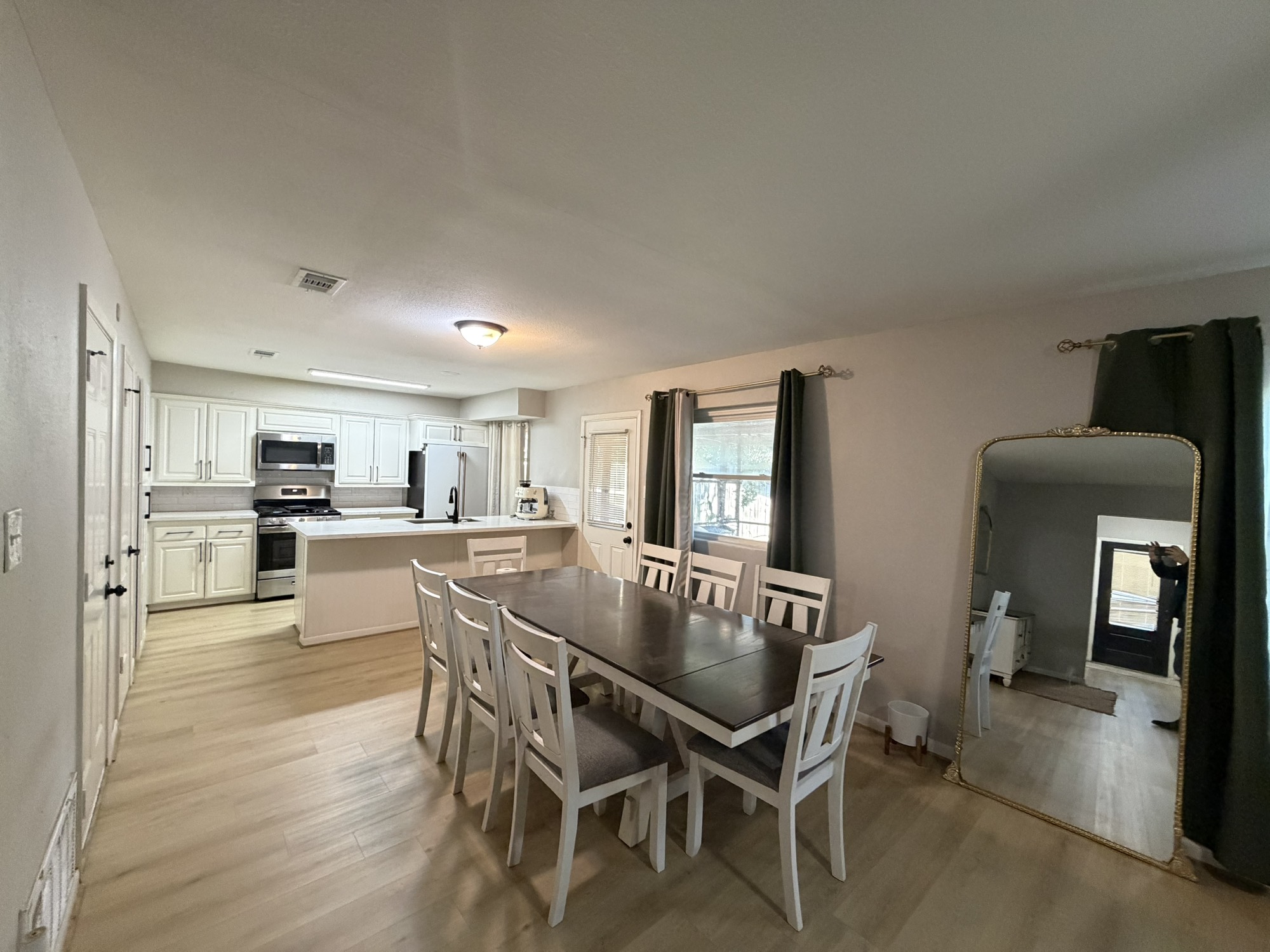 9022 Lazy River Lane Houston, TX 77088 - Photo 22 of 23 a view of a dining room with furniture and wooden floor