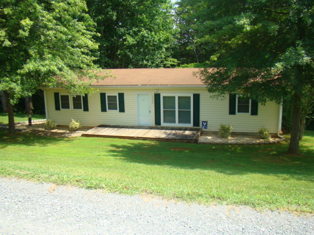 1060 Dickerson Road Goodview, VA 24095 - Photo 1 of 5 a view of a house with a backyard