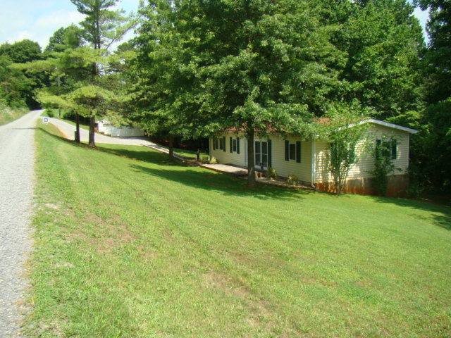 1060 Dickerson Road Goodview, VA 24095 - Photo 4 of 5 a view of a house with a yard