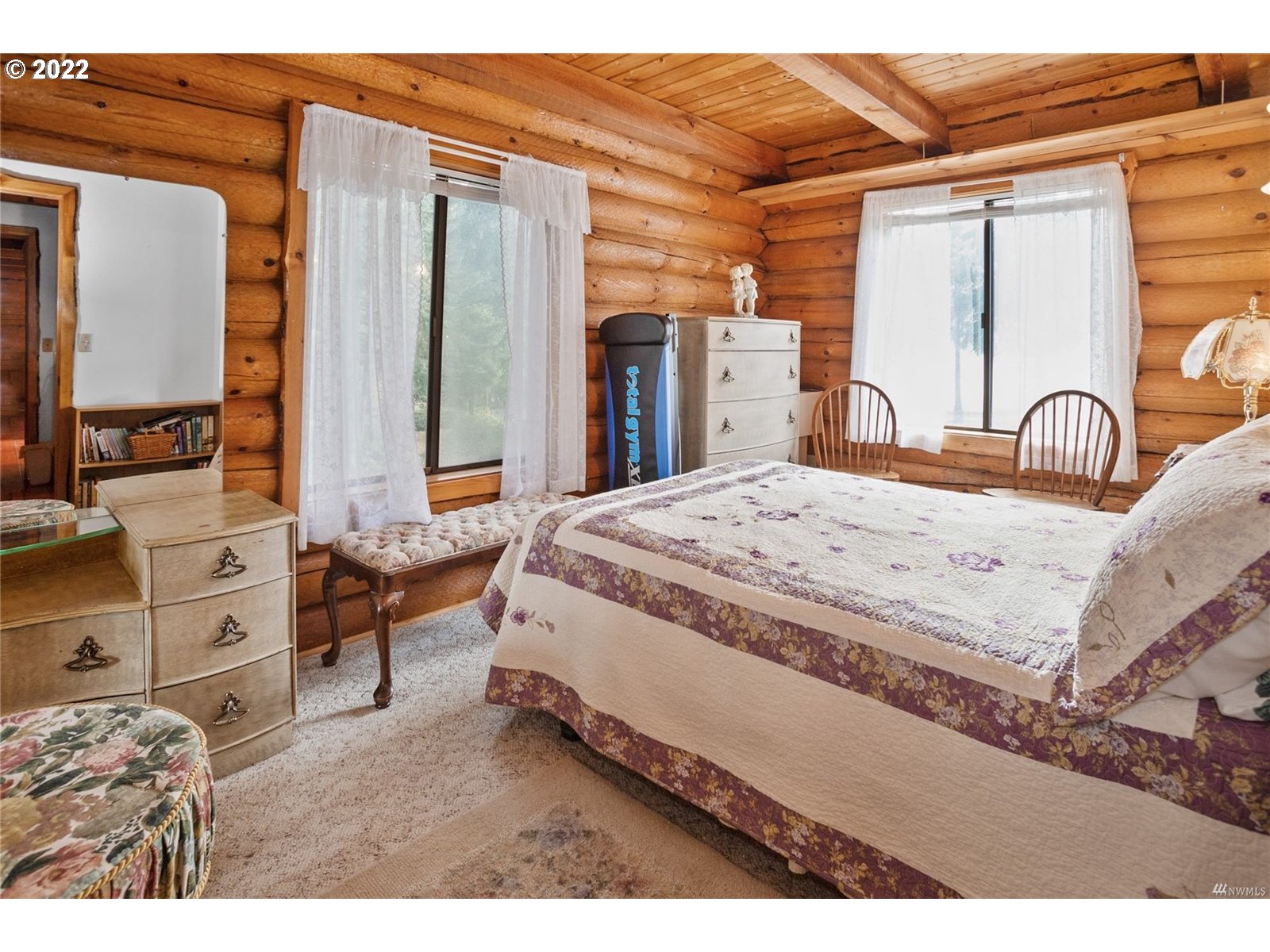 248 Coma Road Winlock, WA 98596 - Photo 14 of 30 a spacious bedroom with a bed a dresser and mirror