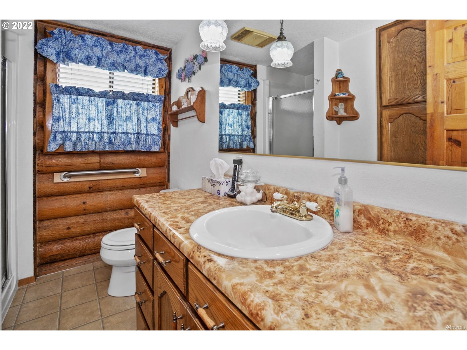 248 Coma Road Winlock, WA 98596 - Photo 15 of 30 a bathroom with a sink a toilet and mirror