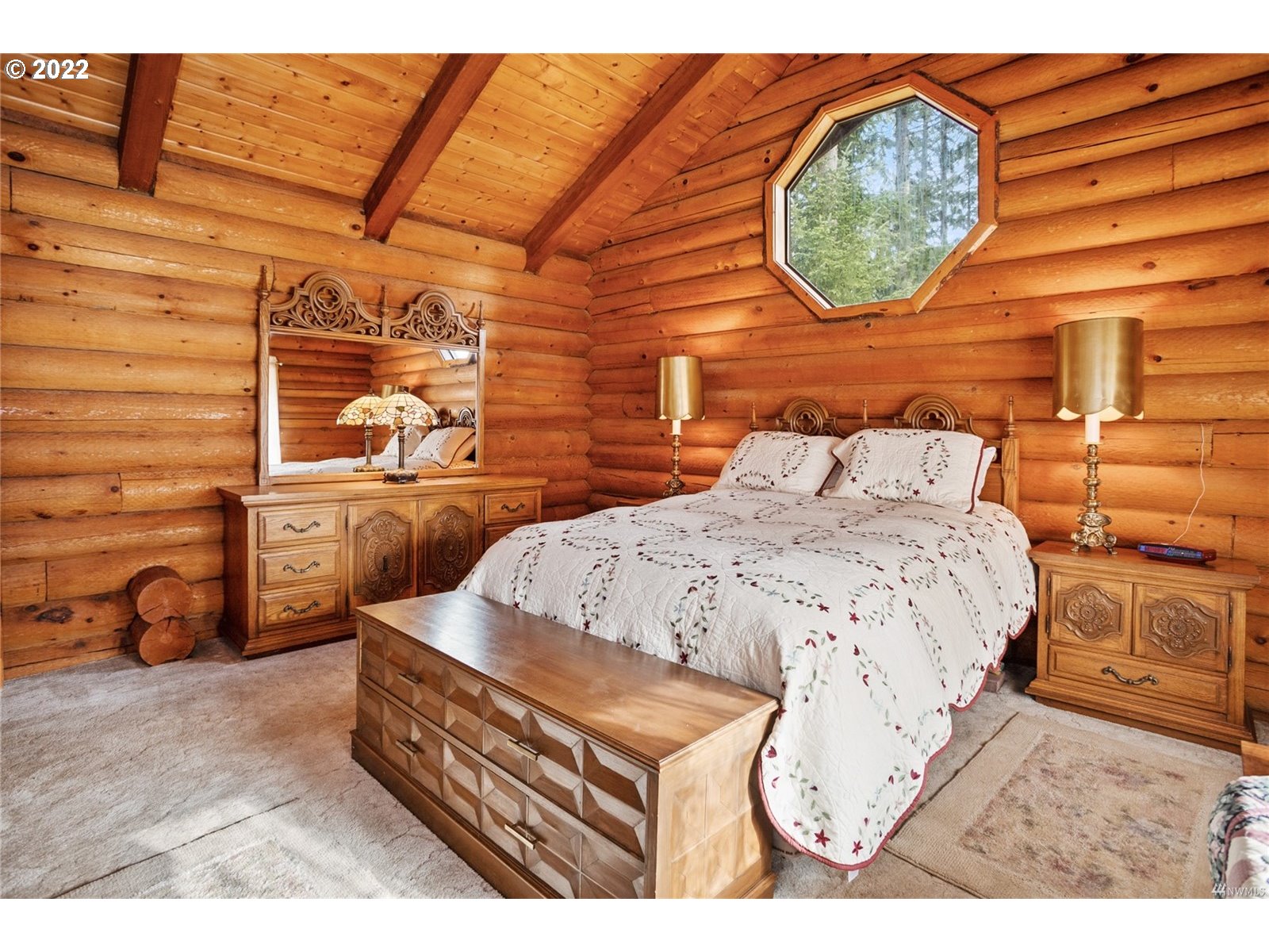 248 Coma Road Winlock, WA 98596 - Photo 20 of 30 a bed room with a bed and a painting on the wall