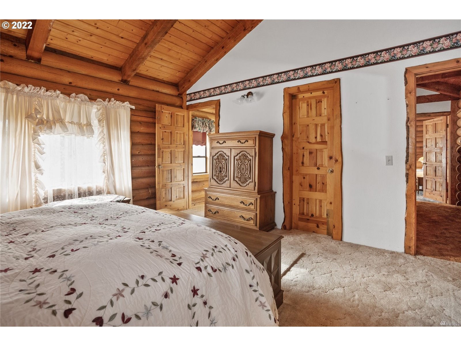 248 Coma Road Winlock, WA 98596 - Photo 21 of 30 a bedroom with a large bed and a window