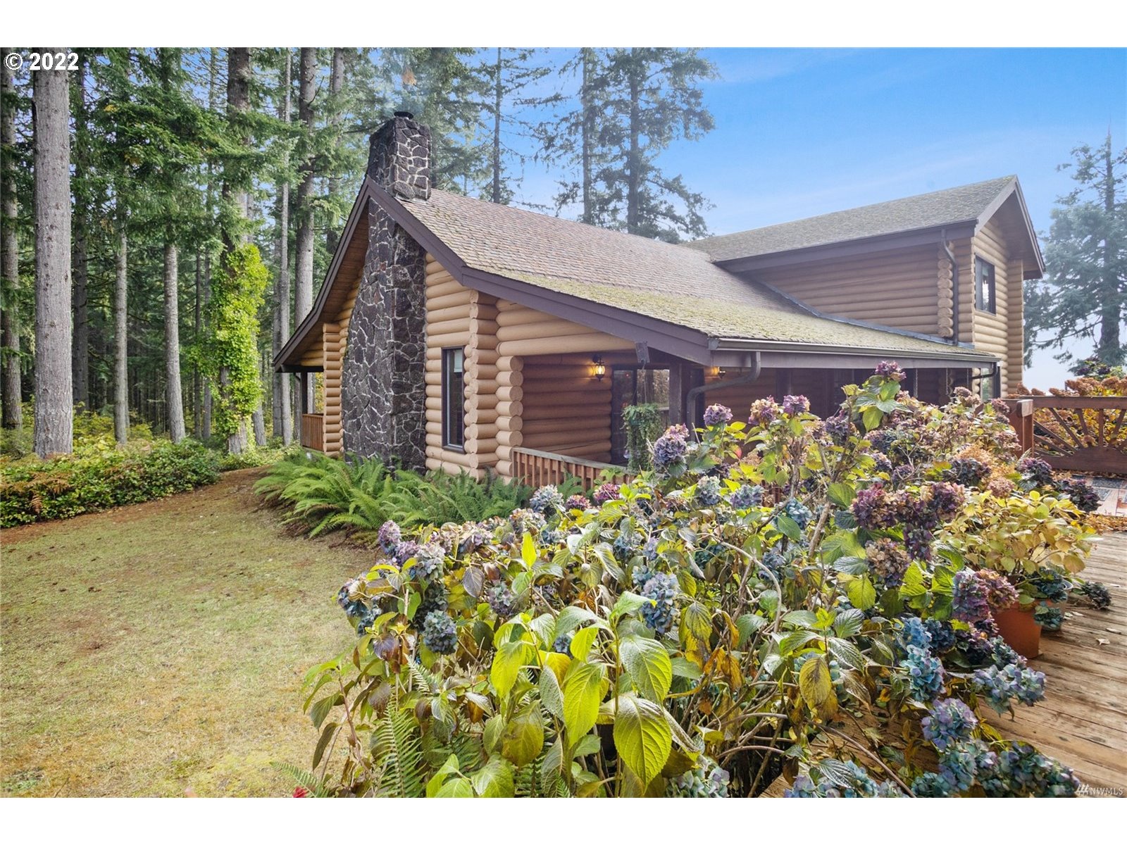 248 Coma Road Winlock, WA 98596 - Photo 23 of 30 a view of a house with a flower garden