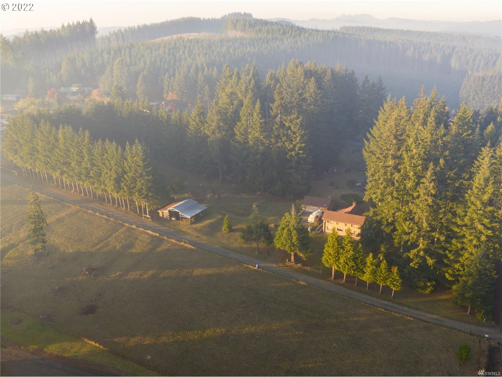 248 Coma Road Winlock, WA 98596 - Photo 26 of 30 a view of a lake with a mountain in the background