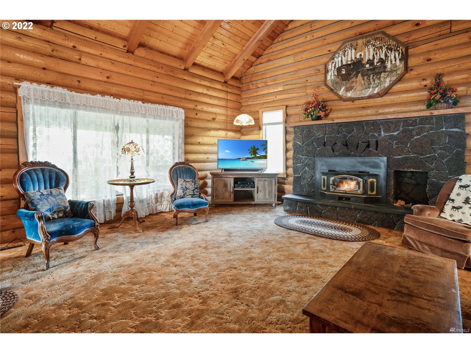 248 Coma Road Winlock, WA 98596 - Photo 5 of 30 a living room with furniture and a fireplace