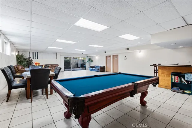 a room with furniture and air hockey table