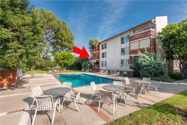 a view of a patio with a table and chairs
