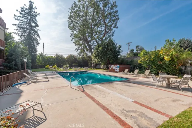 a view of a swimming pool with a lounge chair