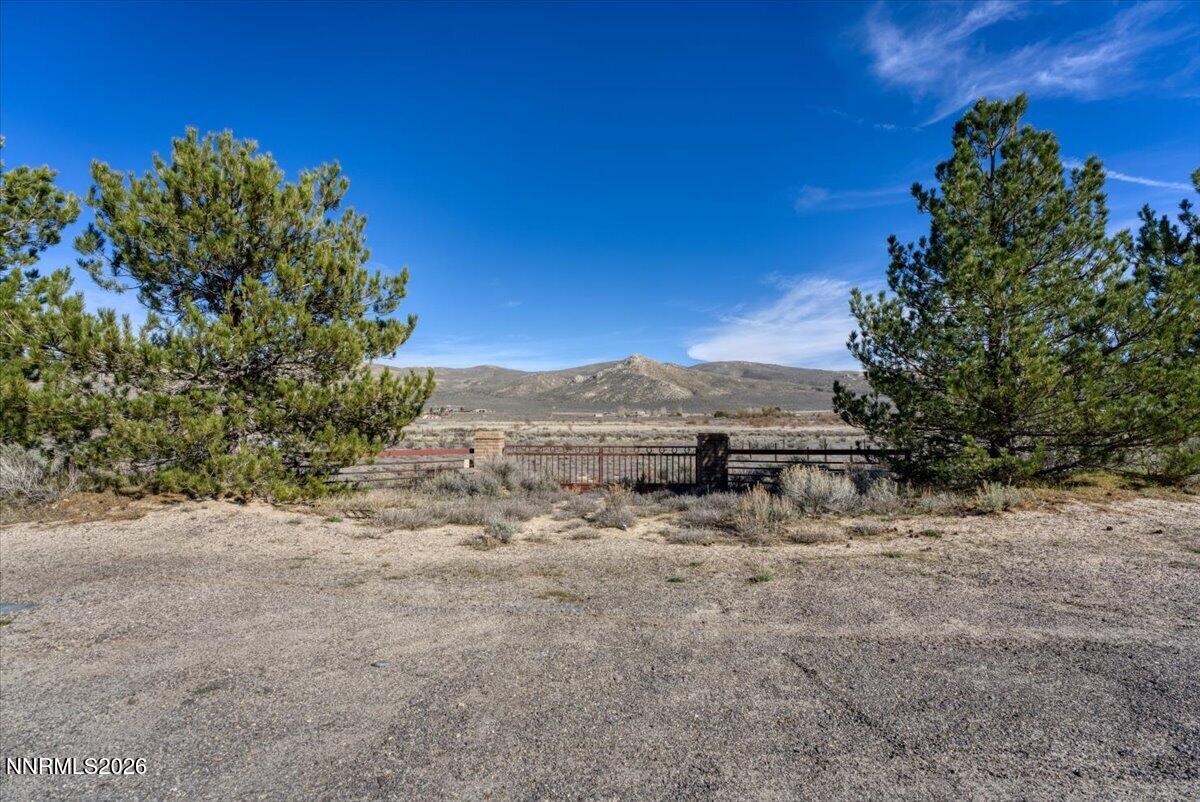 15210 North Red Rock Road Reno, NV 89508 - Photo 4 of 30 a view of a dry yard with trees