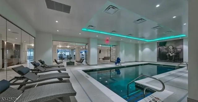 a living room with furniture and a view of the room