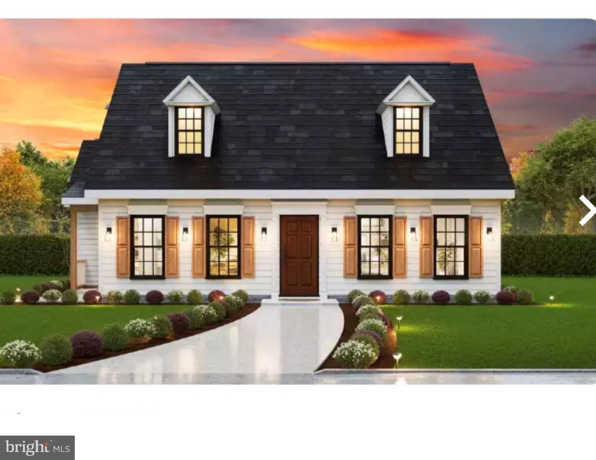 a view of front of a brick house with a yard