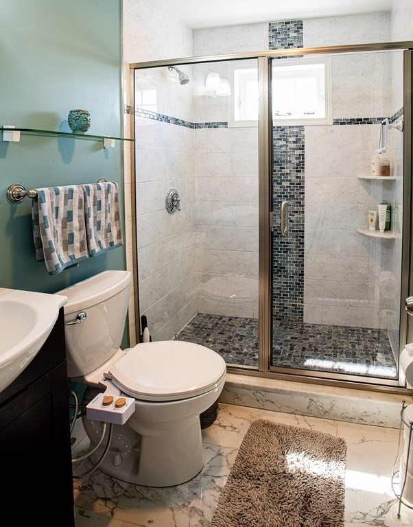 27 Fay Road, Unit 27 Framingham, MA 01702 - Photo 13 of 32 a bathroom with a toilet and shower