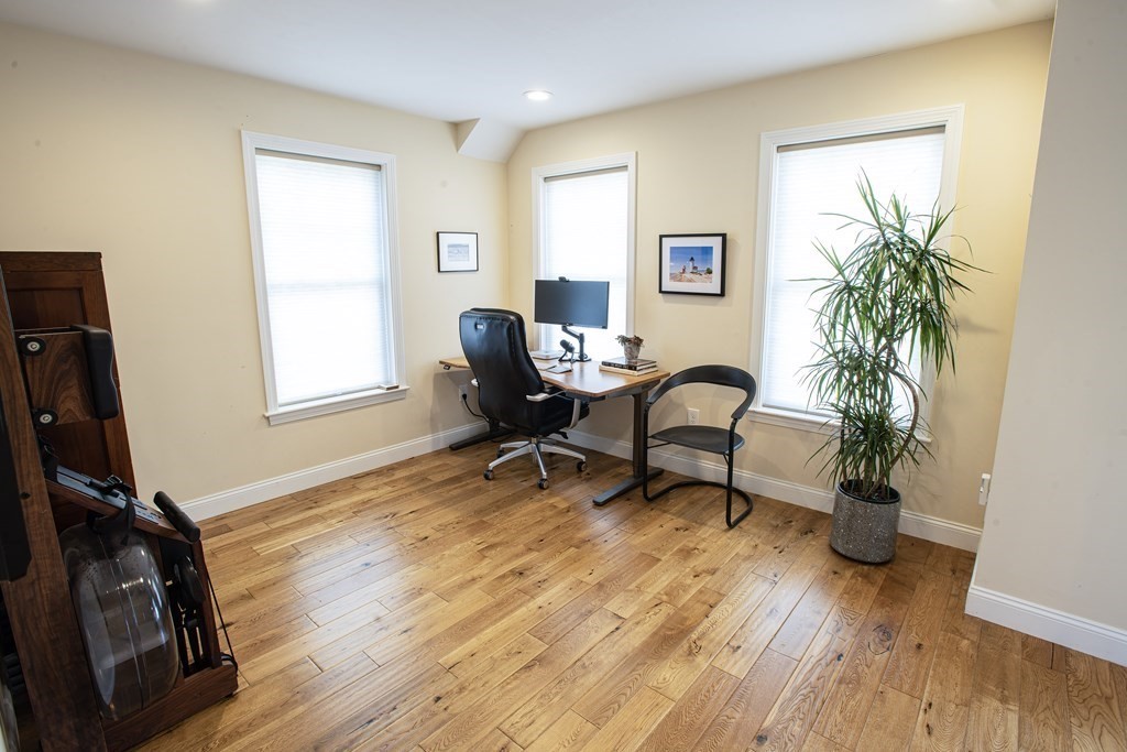27 Fay Road, Unit 27 Framingham, MA 01702 - Photo 17 of 32 a living room with furniture and a wooden floor