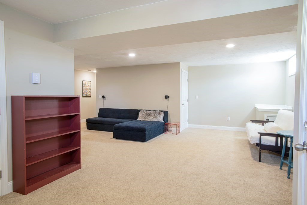 27 Fay Road, Unit 27 Framingham, MA 01702 - Photo 24 of 32 a spacious bedroom with a bed and a chair