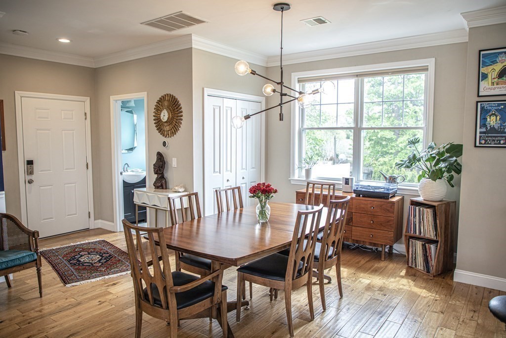 27 Fay Road, Unit 27 Framingham, MA 01702 - Photo 6 of 32 a view of a dining room with furniture window and wooden floor