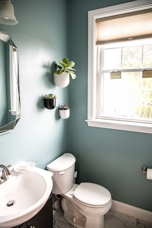 27 Fay Road, Unit 27 Framingham, MA 01702 - Photo 8 of 32 a bathroom with a toilet a sink and mirror