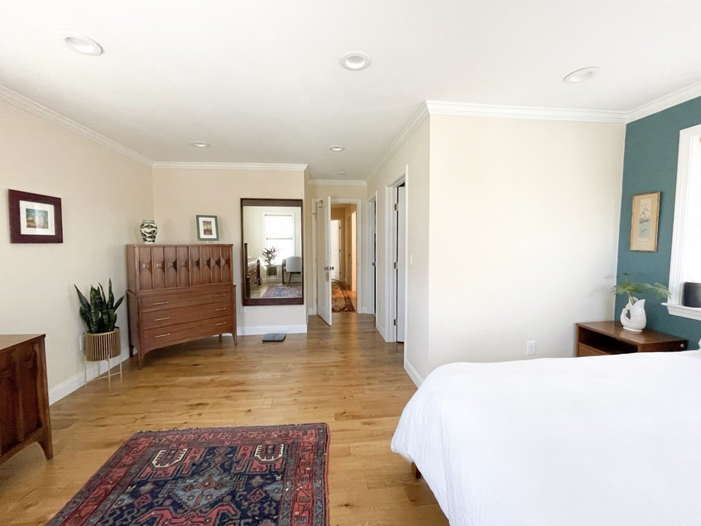 27 Fay Road, Unit 27 Framingham, MA 01702 - Photo 10 of 32 a spacious bedroom with a bed and a couch