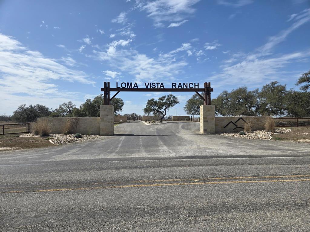 a sign board with street view