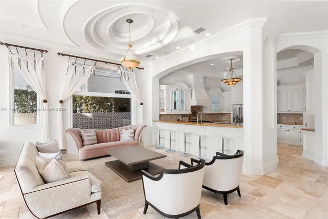 a room with furniture and large window