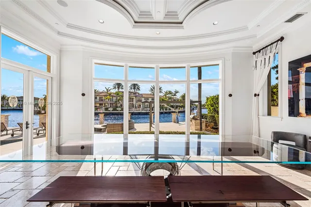 a house with swimming pool in front of it