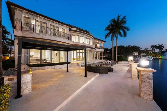 a balcony with wooden floor and city view