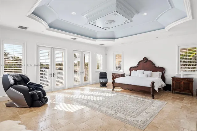 a large spacious bathroom with a granite countertop sink and a mirror
