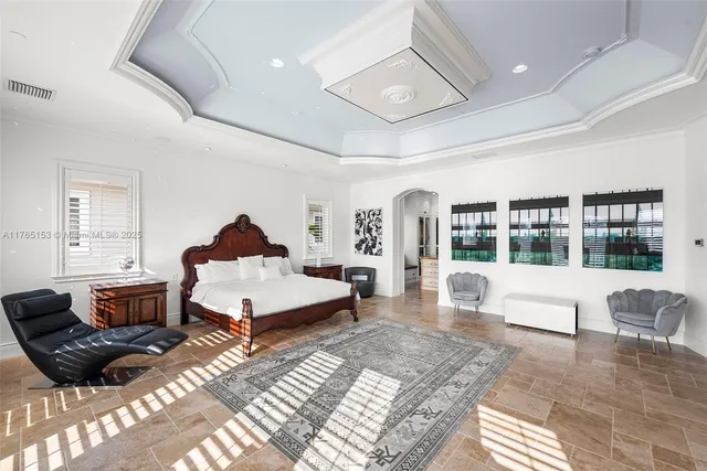 a spacious bathroom with a granite countertop sink a mirror and bathtub