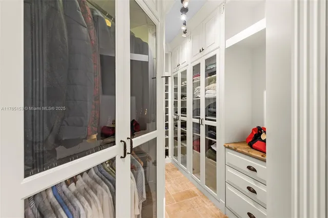 a balcony with wooden floor and outdoor seating