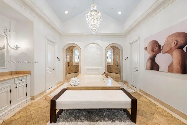 a bedroom with furniture and a window