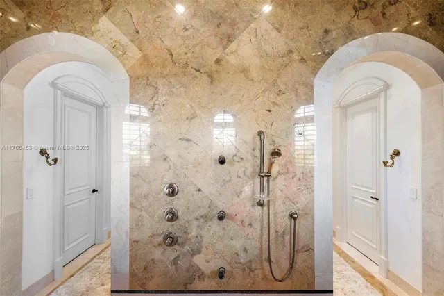 a bathroom with a bathtub and shower