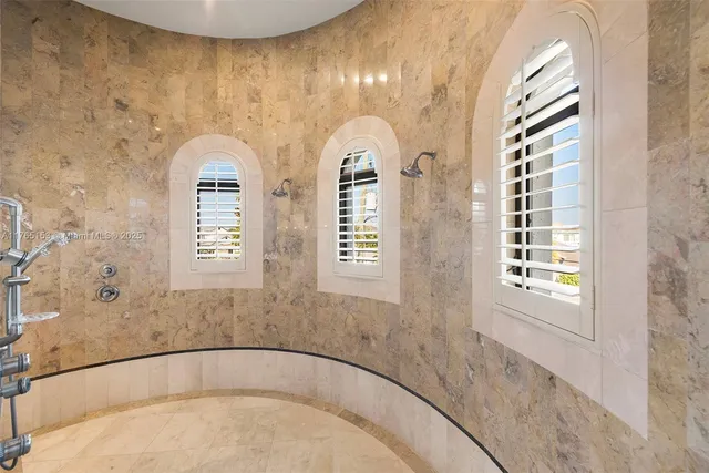a bathroom with a sink vanity granite and a mirror