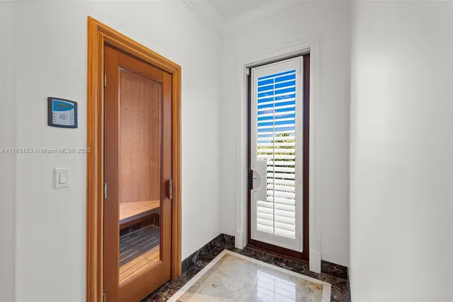 a en suite bathroom with a granite countertop sink and a mirror