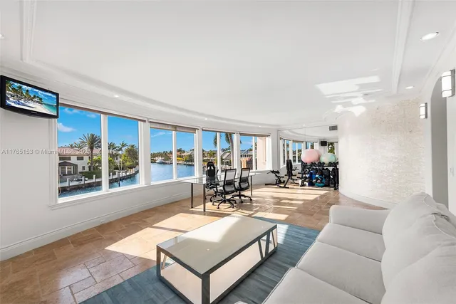 a view of a patio with a table and chairs under an umbrella