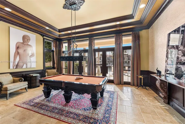 a front view of a house with a yard and potted plants