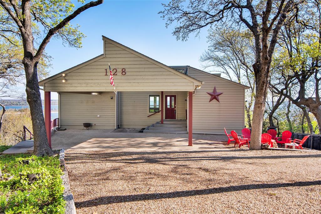 a view of street along with house and trees