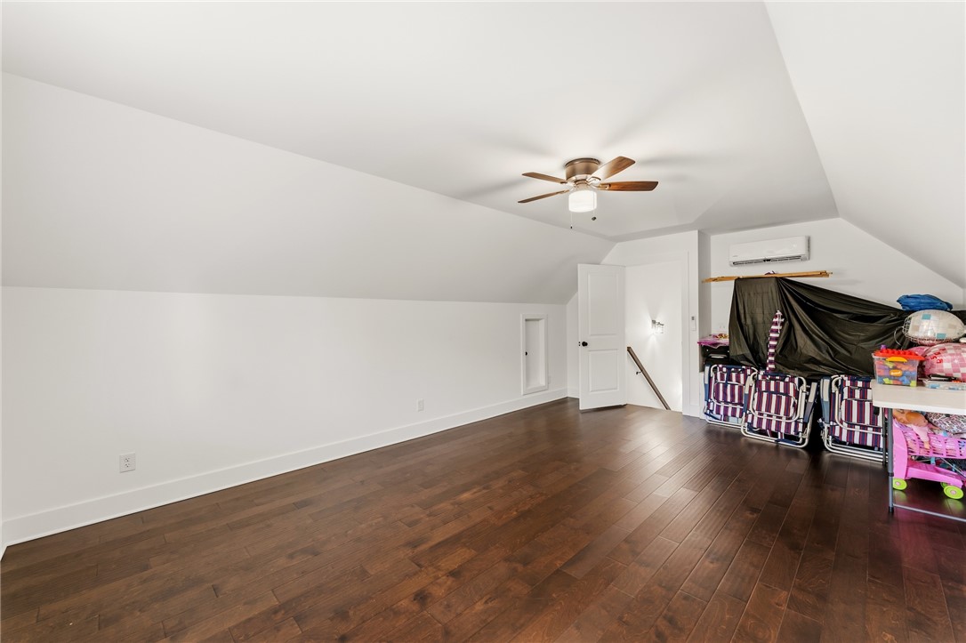 502 Canebrake Drive Anderson, SC 29621 - Photo 34 of 39 This spacious bonus room features rich hardwood flooring and sloped ceilings.
